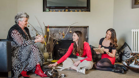 Photo of Maxine Laceby, Margot Laceby and Darcy Laceby sitting in a festively decorated room