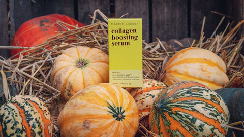 Photo of a yellow box of Absolute Collagen's Maxerum serum atop a pile of pumpkins, with hay in the background