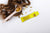 Image of brown hair beside a spoonful of vitamins and a yellow Absolute Collagen sachet